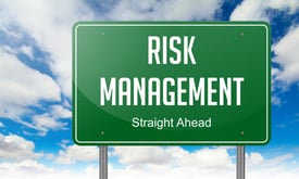Risk Management - Highway Signpost on Sky Background.